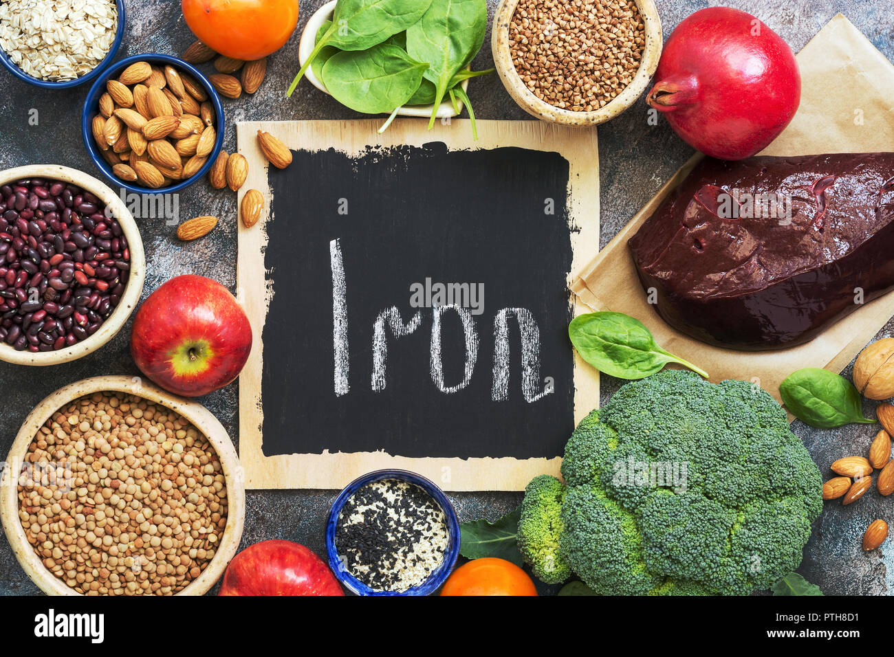 Foods high in iron. Vegetables, fruits rich in iron on a rustic background.  Top view, flat lay, copy space Stock Photo - Alamy