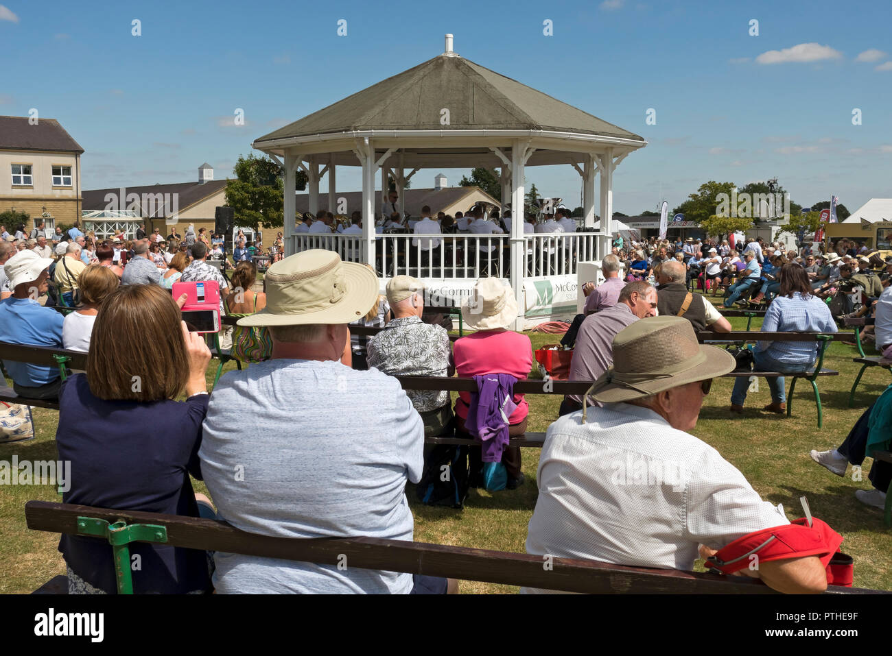 People listening to band playing music at the Great Yorkshire Show in summer Harrogate North Yorkshire England UK United Kingdom GB Great Britain Stock Photo