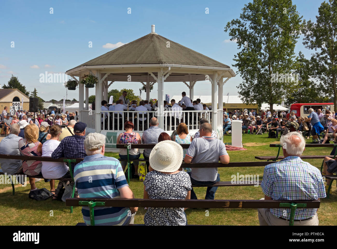 People listening to band playing music at the Great Yorkshire Show in summer Harrogate North Yorkshire England UK United Kingdom GB Great Britain Stock Photo