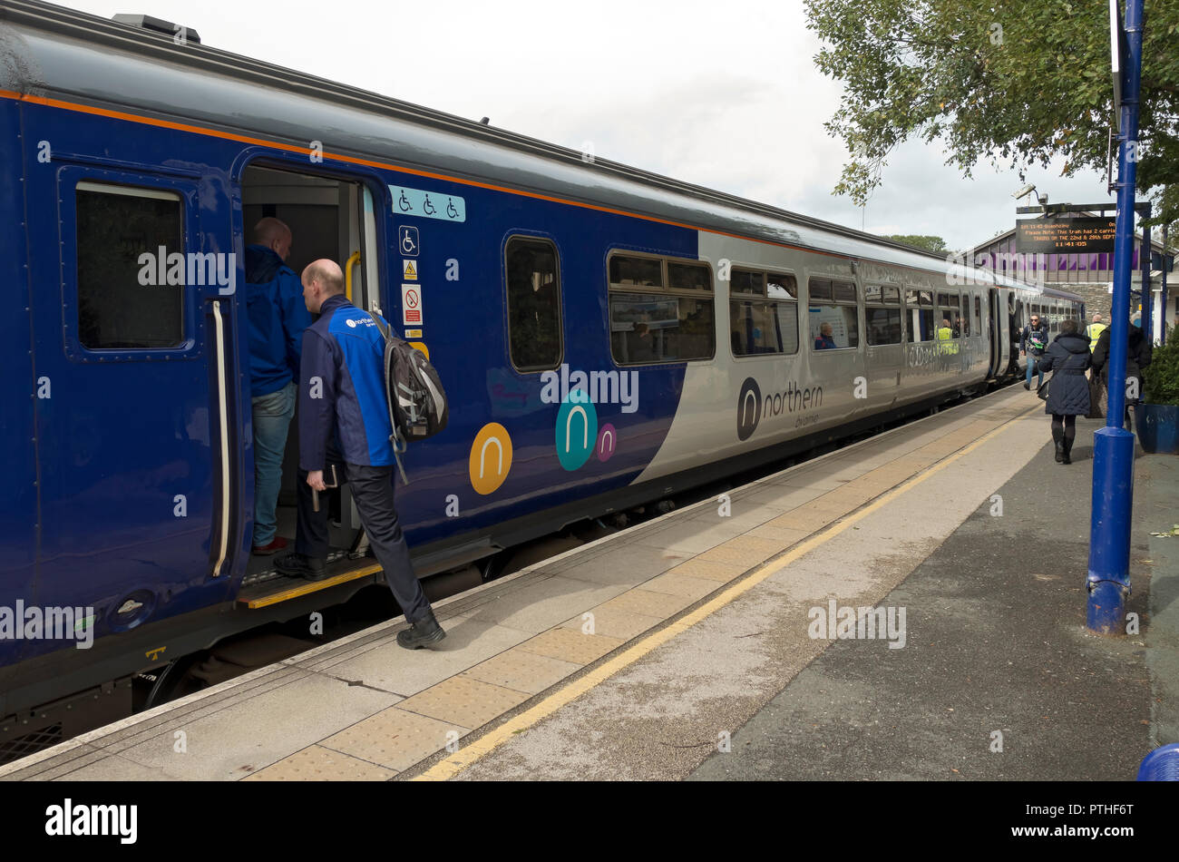 Northern rail train carriage and passengers people at the platform Windermere Railway Station Cumbria England UK United Kingdom GB Great Britain Stock Photo