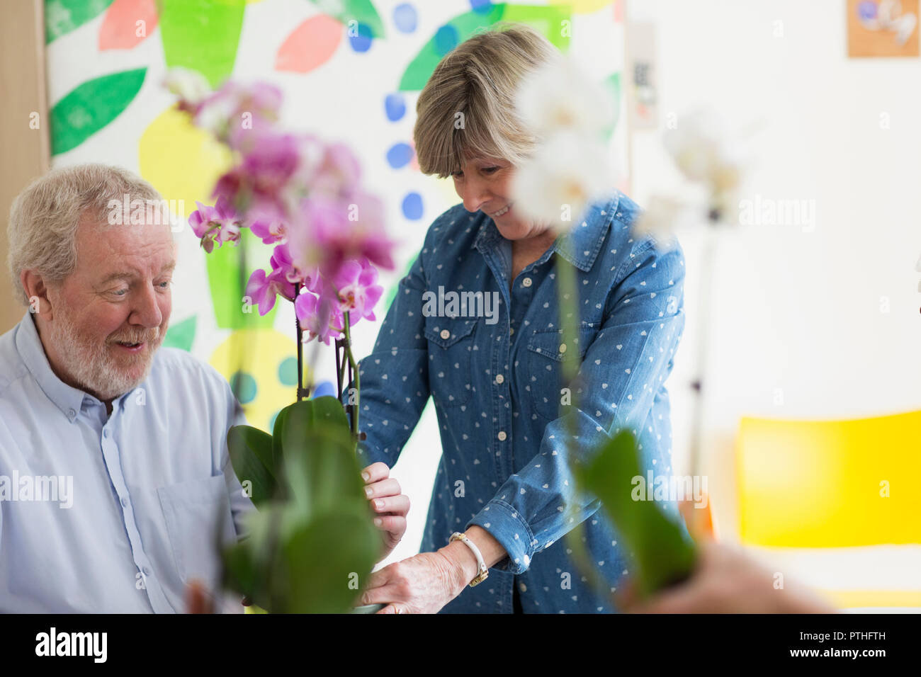 Active senior couple enjoying flower arranging class Stock Photo