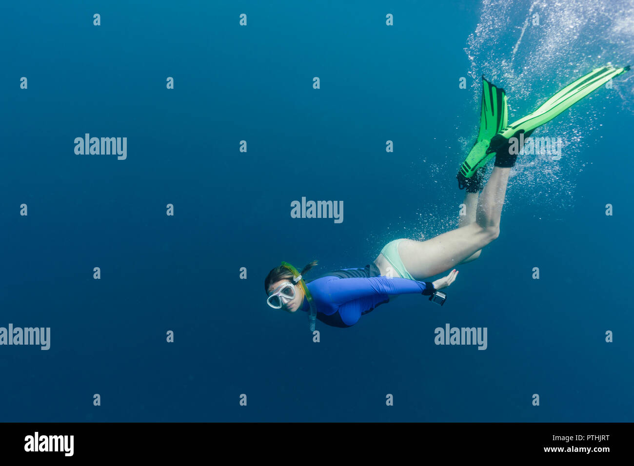 Portrait young woman snorkeling underwater Stock Photo - Alamy