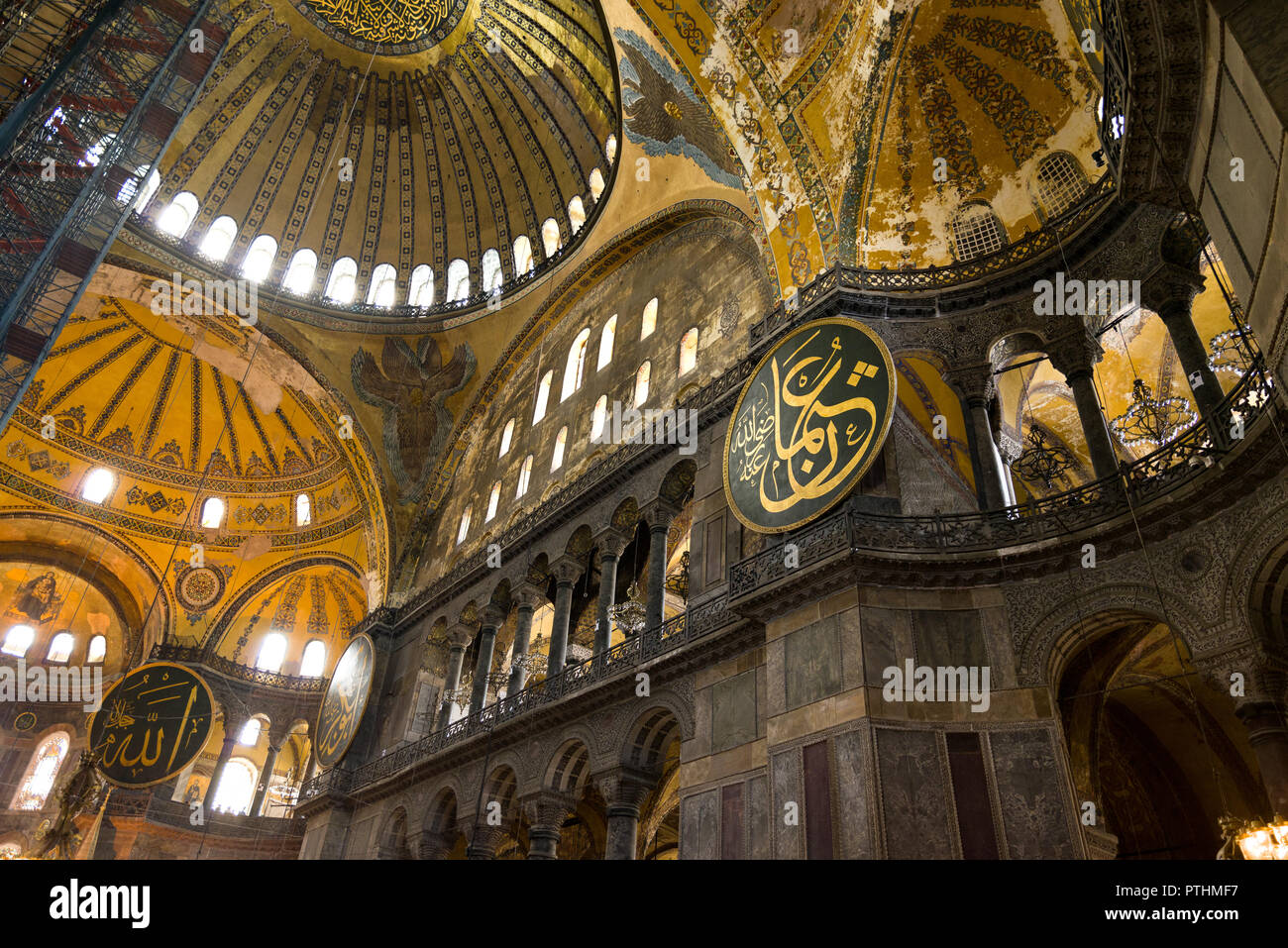Interior nave of the Hagia Sophia museum showing main dome and calligraphic roundels on the walls, Istanbul, Turkey Stock Photo