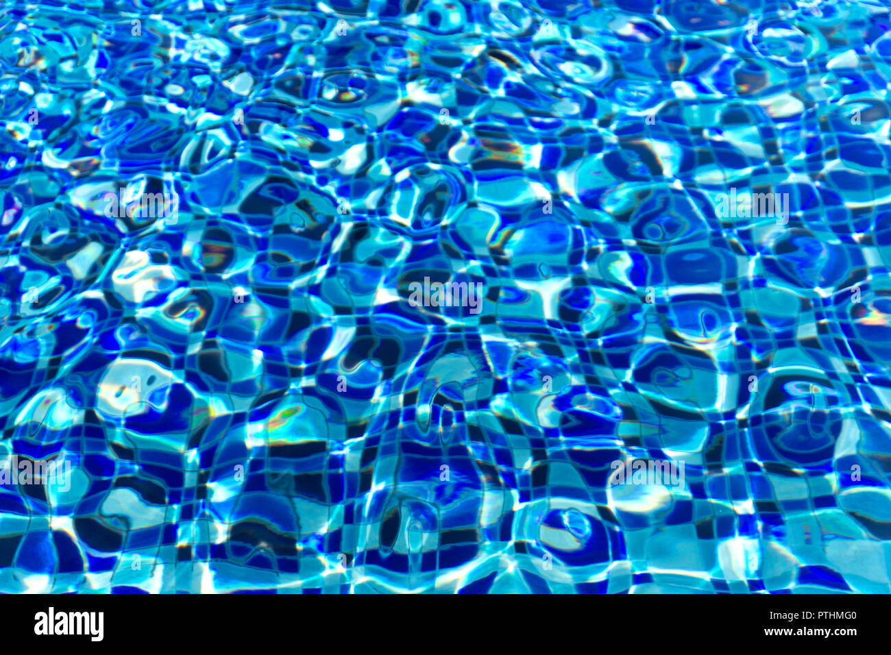 Ripple and flow with waves swimming pool bottom background. Stock Photo