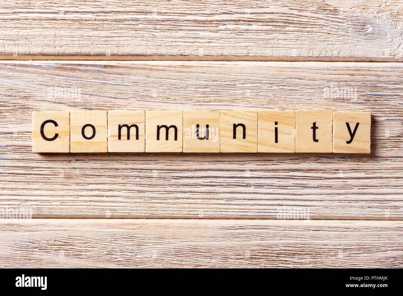 Community word written on wood block. Community text on table, concept. Stock Photo