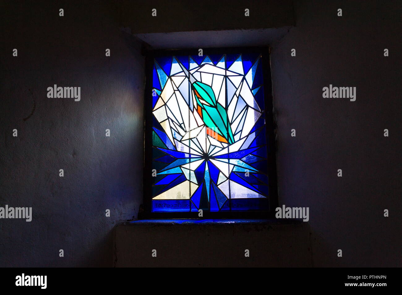 Beautiful kingfisher on stained glass on Old Town Bridge Tower, Charles Bridge, Prague, Czech Republic, sunny day Stock Photo