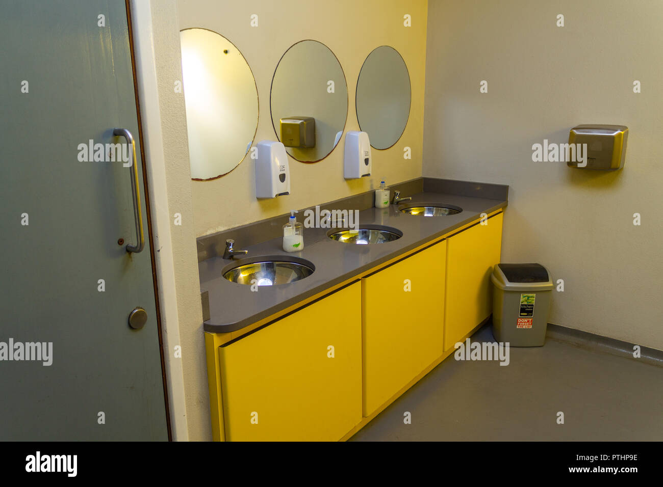 washroom with wash basins and mirrors in a public toilet or lavatory Stock Photo