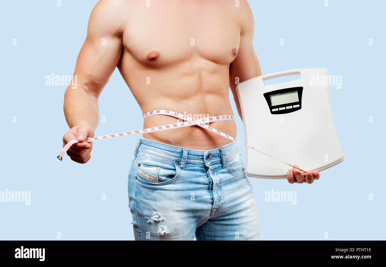 Image of muscular man measure his biceps with measuring tape in centimeters  Stock Photo - Alamy