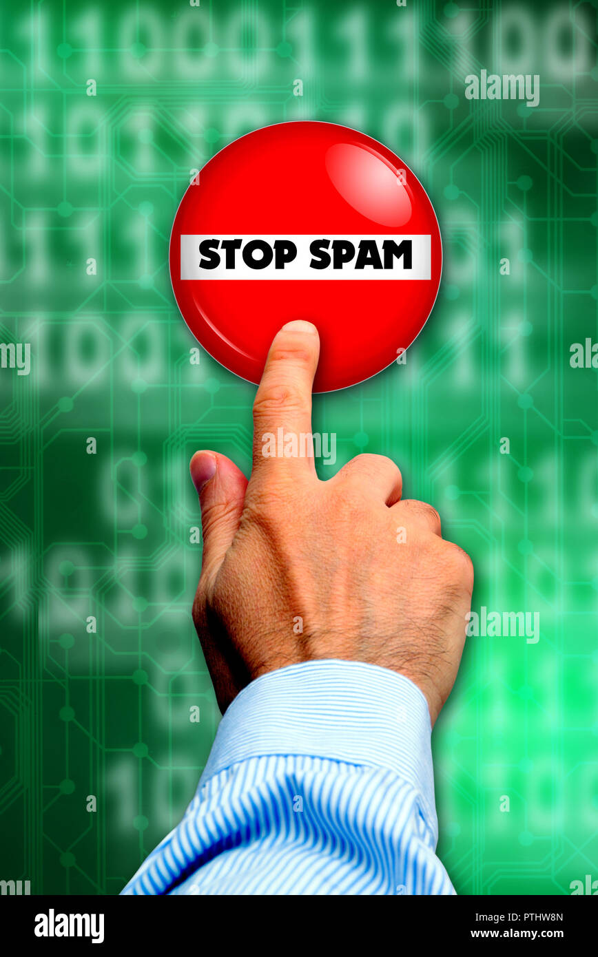 finger pushing a STOP SPAM button Stock Photo