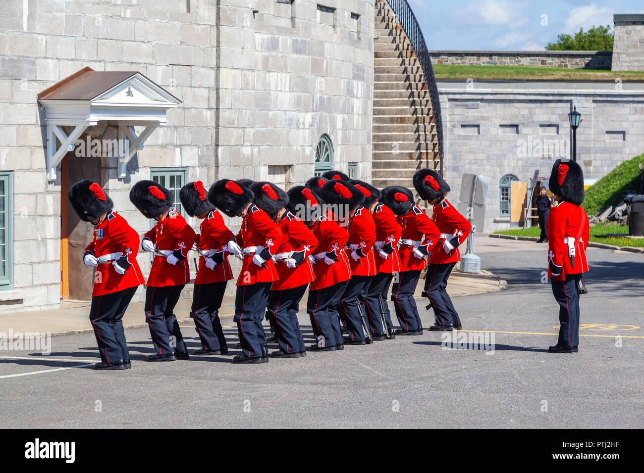 QUEBEC CITY, CANADA - AUG 22, 2012: Canadian soldiers from Royal 22 Regiment in their scarlet regimental dress and bearskins perform the traditional C Stock Photo