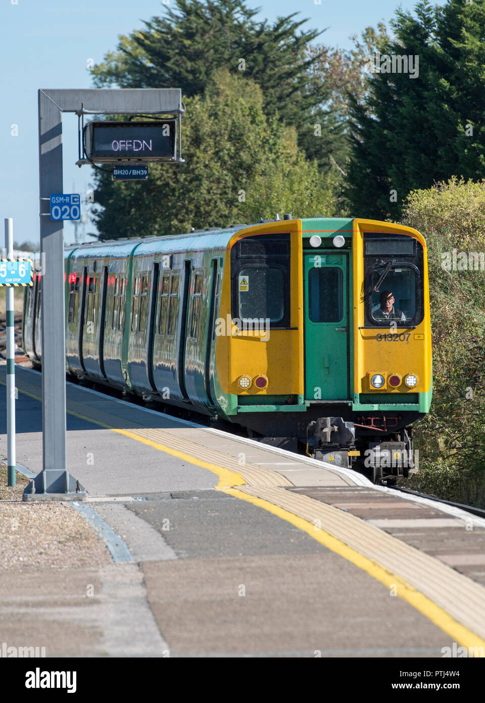 class 313 electric multiple unit train in the platform at barnham station in west sussex heading for Bognor regis as a destination. Stock Photo