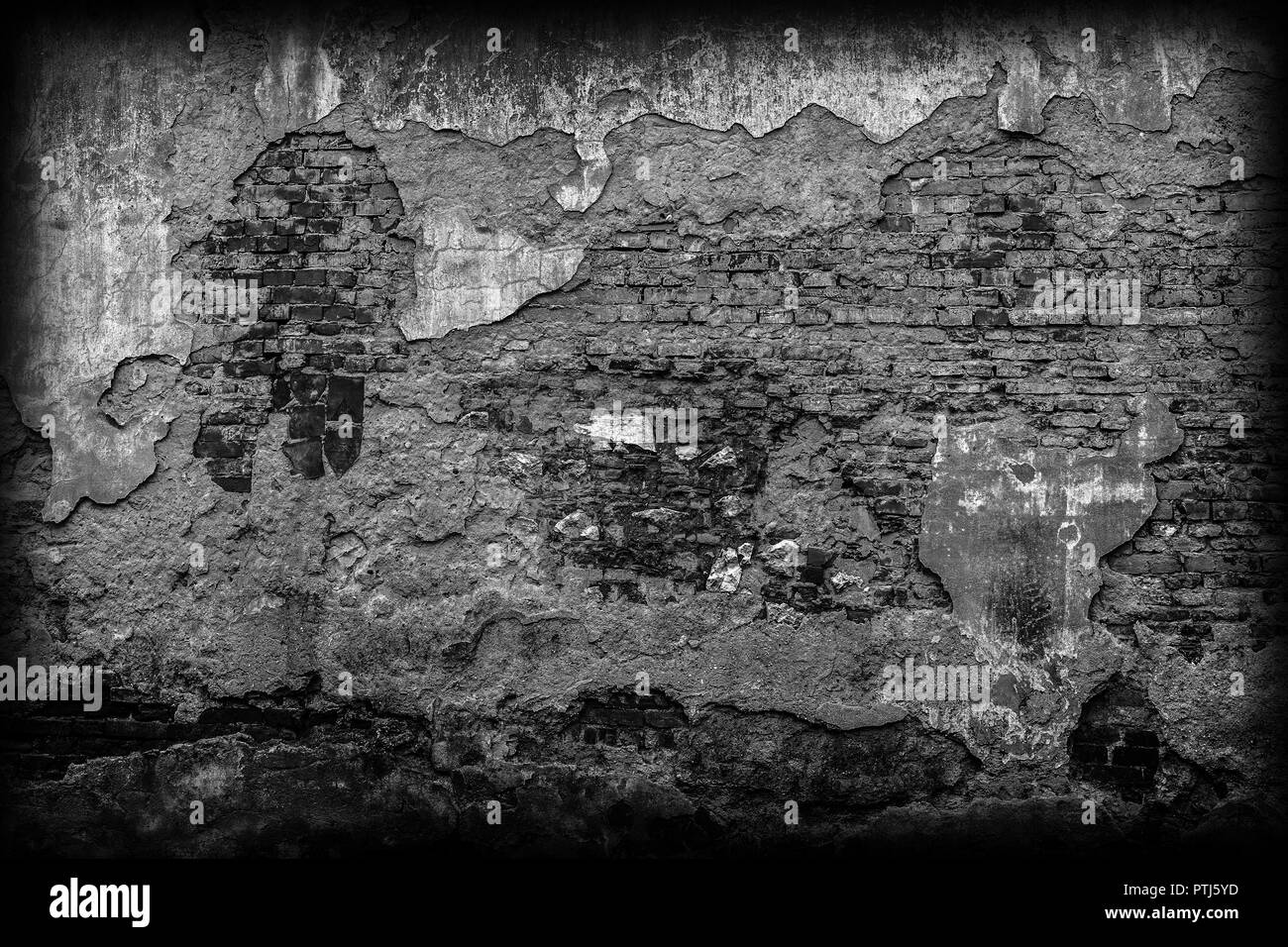 Old black brick wall in a background image Stock Photo - Alamy