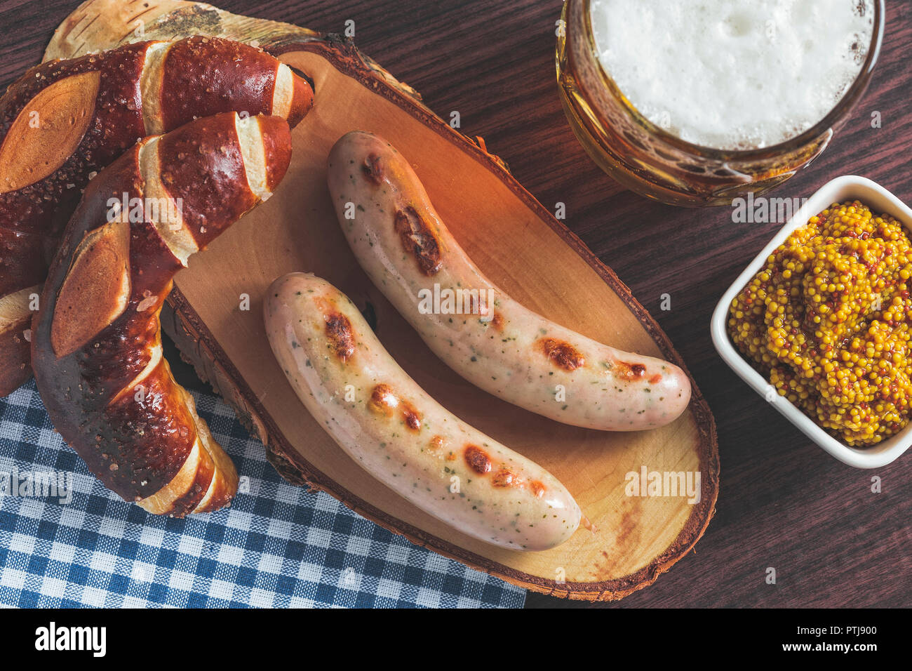 The bavarian weisswurst, pretzel and beer. Stock Photo