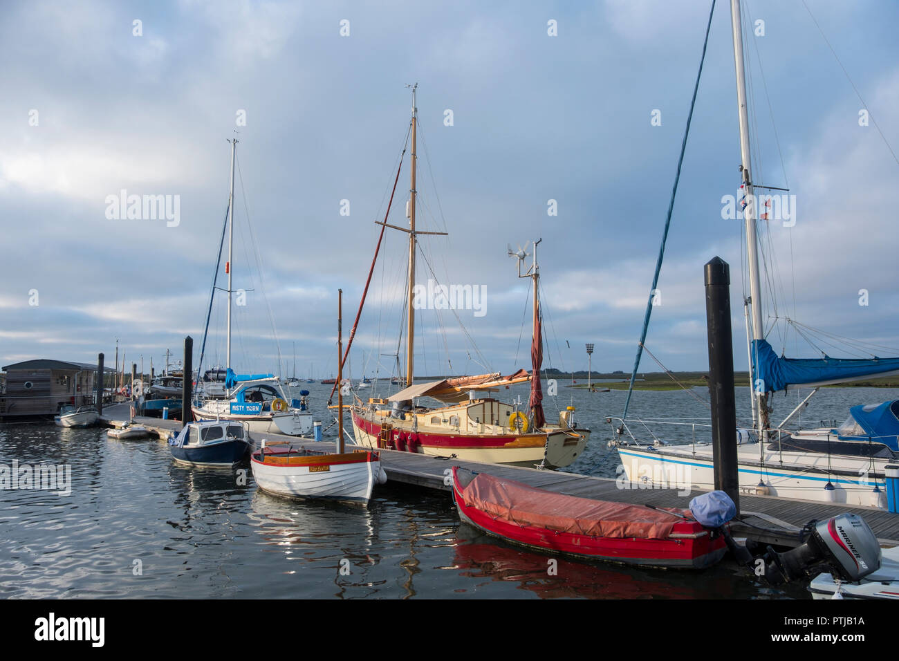 Boats at moorings in the harbour at Wells-next-the-Sea. Stock Photo