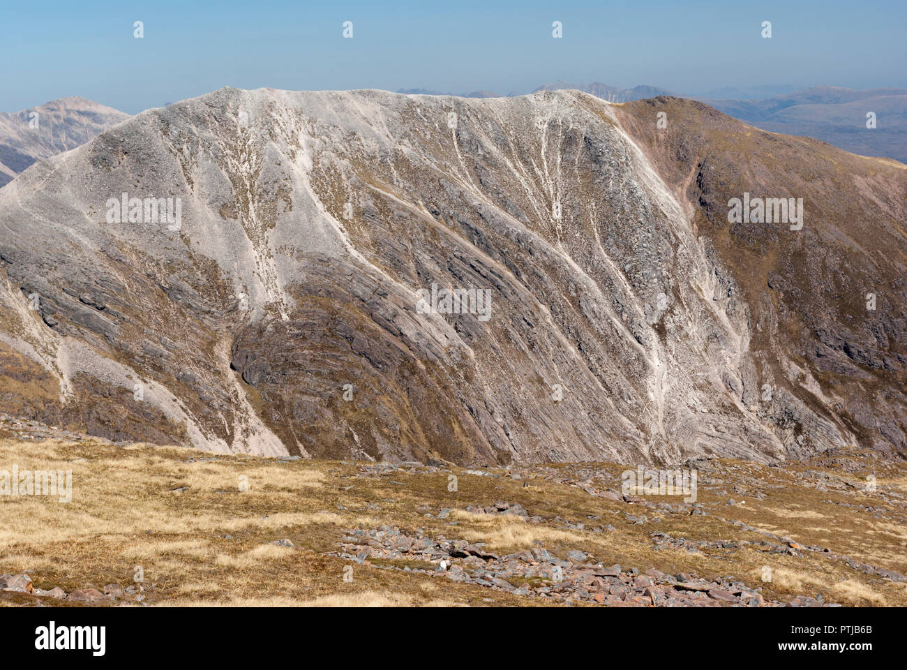 The Scottish Munro of Beinn Liath Mhor seen from Sgorr Ruadh, note the distinctive bands of quartzite and sandstone, Achnashellach, Wester Ross, UK Stock Photo