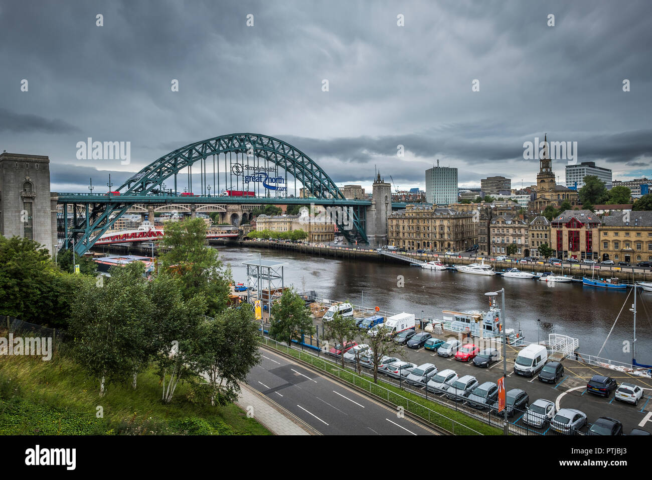 View of Newcastle with the Tyne Bridge carrying an advert for the Great North Run. Stock Photo