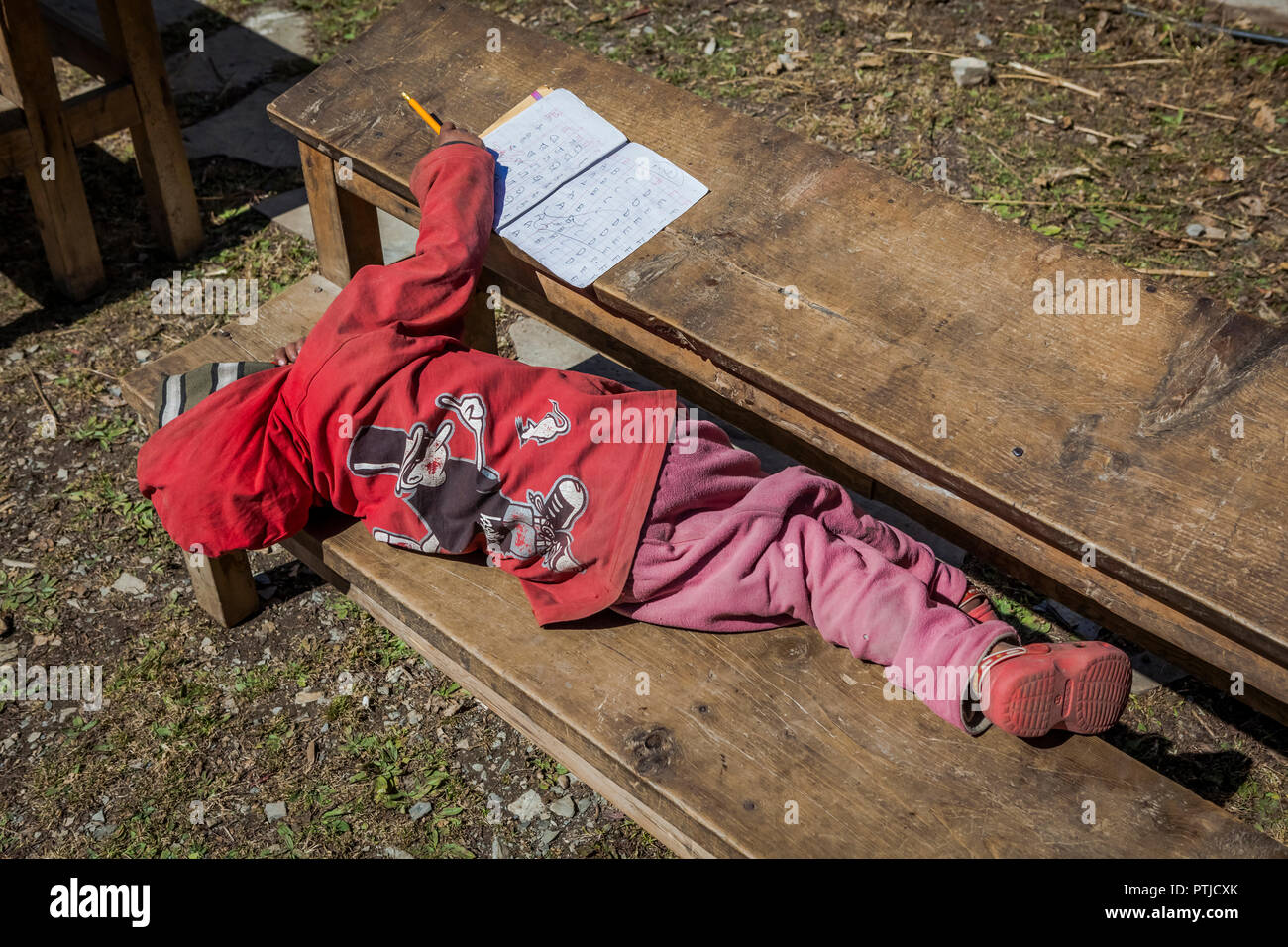 Child student playing outside whilst studying Stock Photo - Alamy