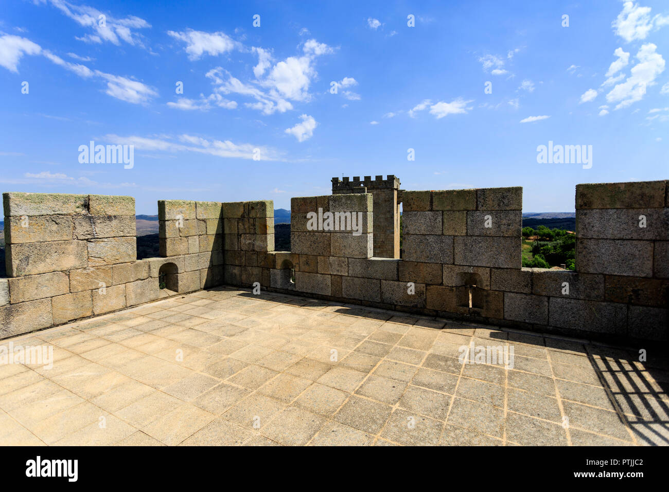 View of the south tower roof with granite floor, parallelepiped merlons and cross shaped arrowslits, in Pinhel, Portugal Stock Photo