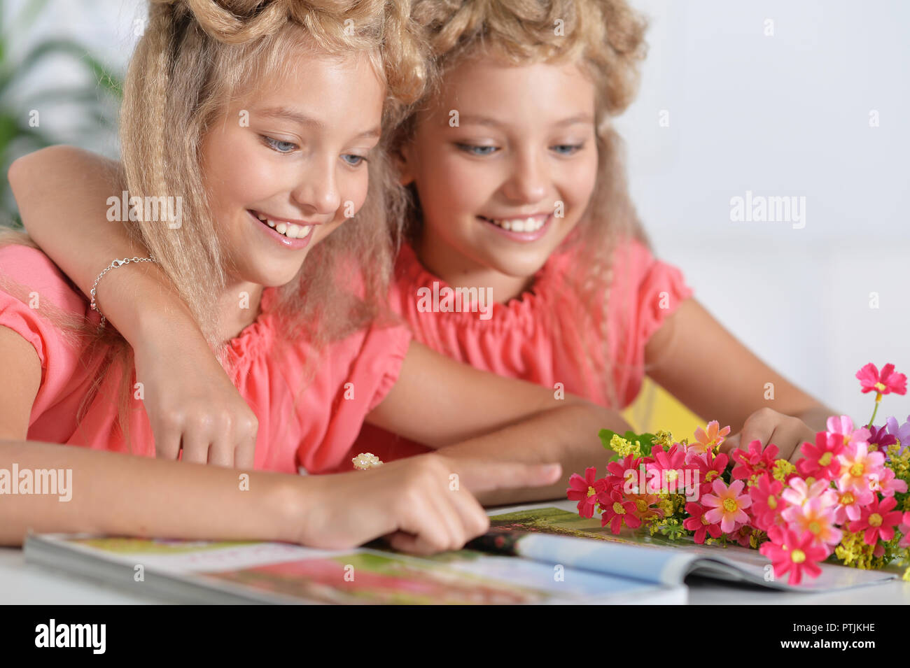 Two Adorable Twin Sisters With Modern Hairstyles Stock Photo Alamy