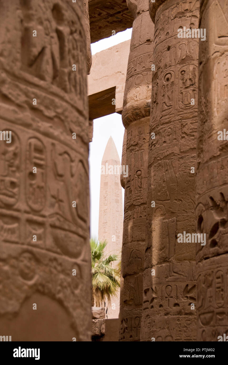 The obelisk of Thutmose I, viewed between columns of the Great Hypostyle Hall in Karnak Temple at Luxor, Egypt. Stock Photo