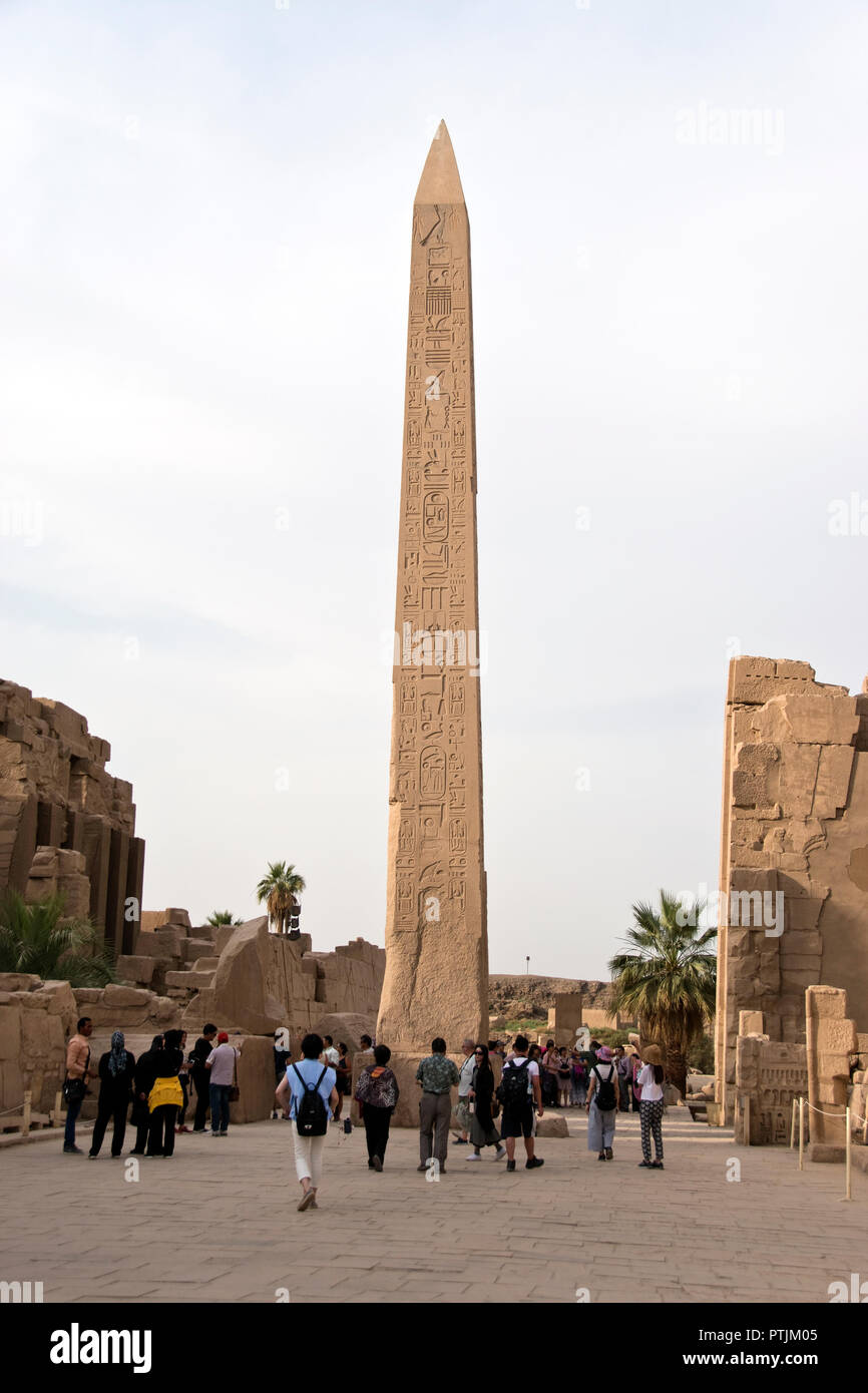 Tourists view the obelisk of Thutmose I at the Karnak Temple complex, Luxor, Egypt. Stock Photo
