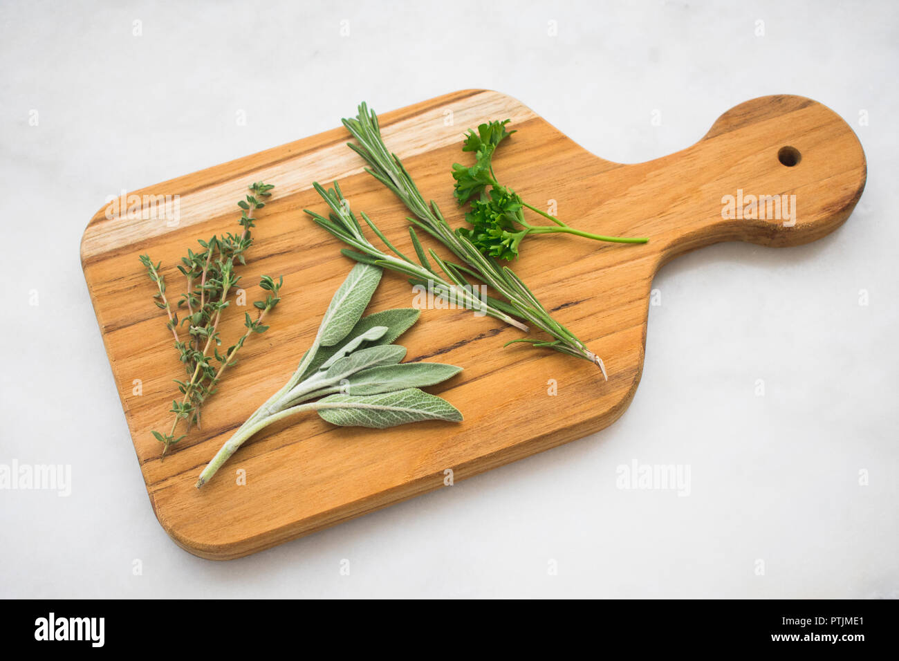 Fresh Herbs on a Cutting Board Stock Photo