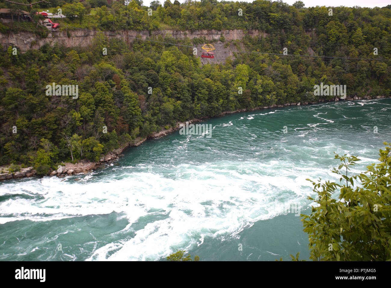 Niagara Falls, USA – August 29, 2018: Aero Cable car suspended on a sturdy cable with the view of the Niagara Whirlpool wild rivers from New York Stat Stock Photo