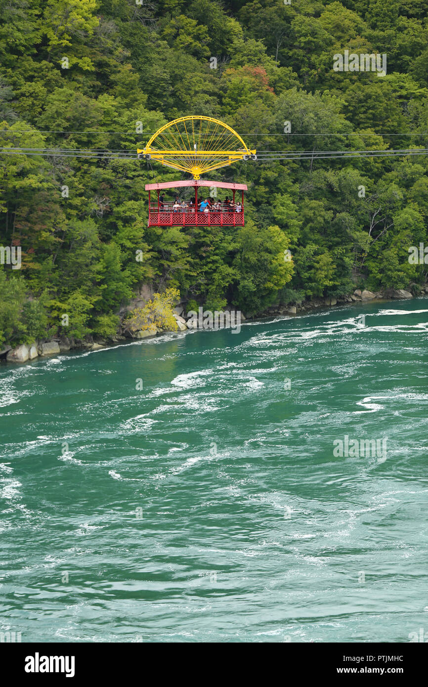 Niagara Falls, USA – August 29, 2018: Aero Cable car suspended on a sturdy cable with the view of the Niagara Whirlpool wild rivers from New York Stat Stock Photo