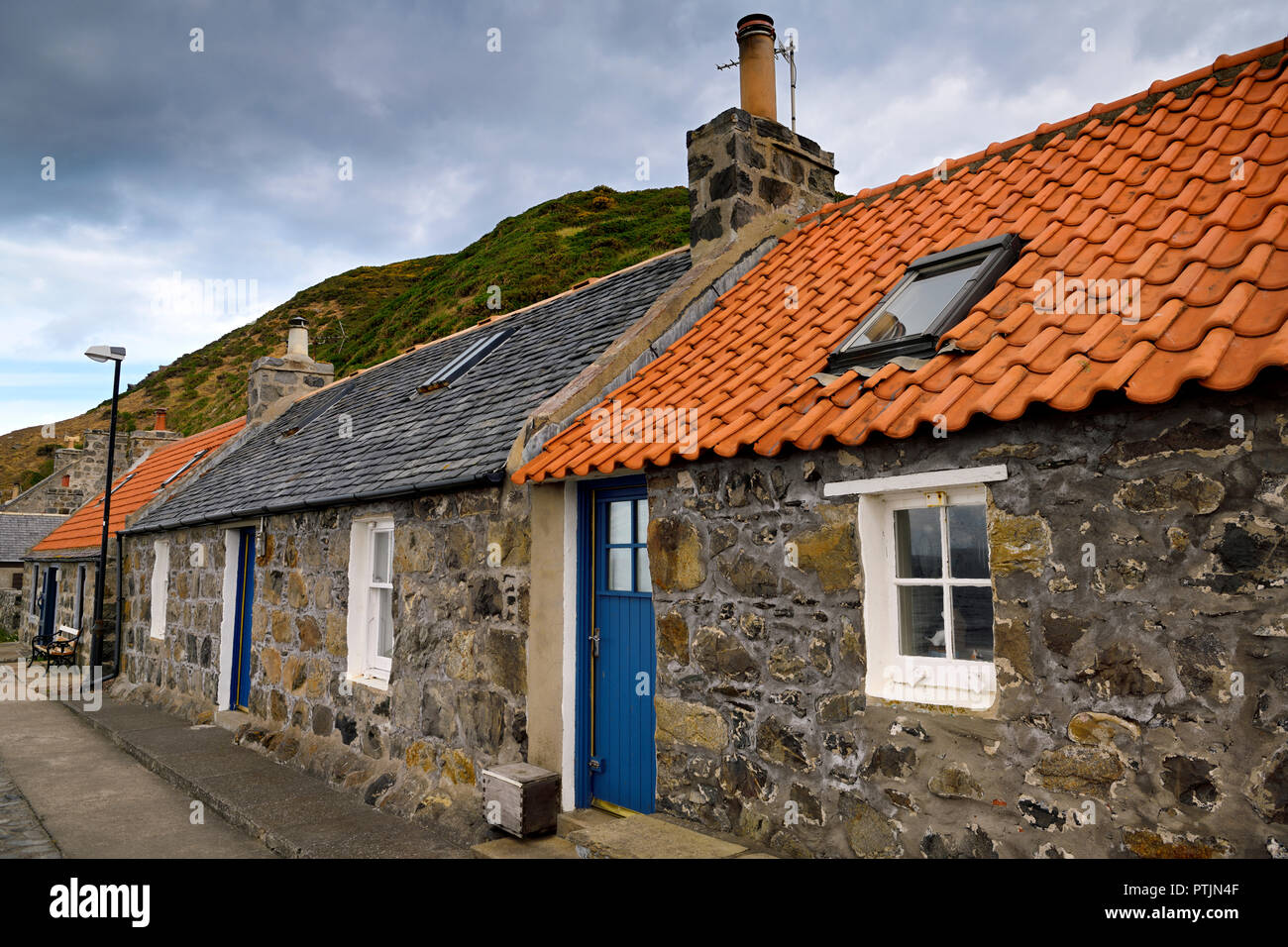 Row of stone houses in coastal fishing village of Crovie Banff
