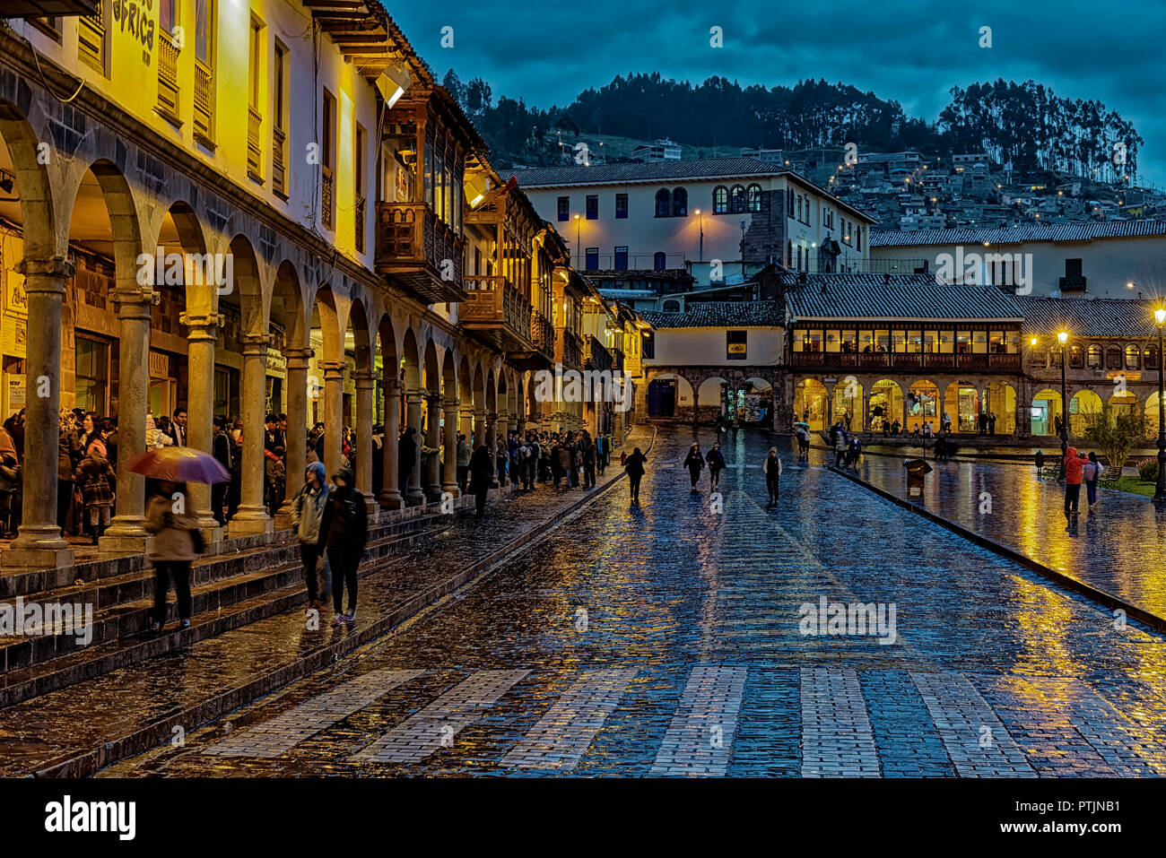 Reflections in the street of Plaza de Armas in Cusco after an evening rainstorm Stock Photo