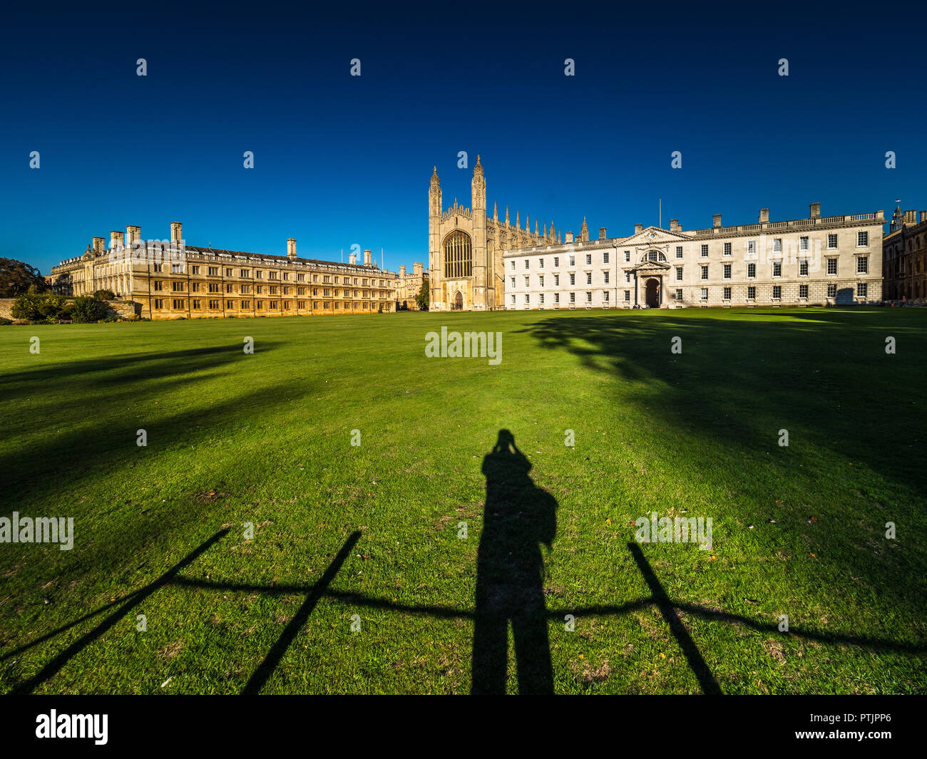 Cambridge Tourism - a tourist takes a photo of the famous Kings College Chapel in the grounds of Kings College, part of the University of Cambridge Stock Photo