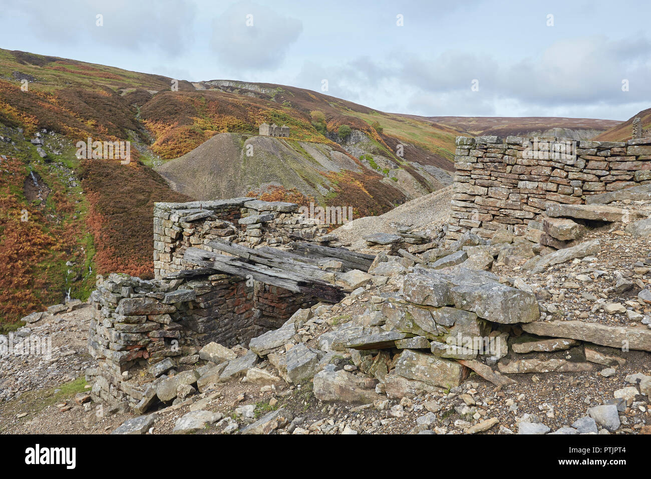 Remains of the once thriving lead mining industry, part of the Bunting mine, upper reaches of Gunnerside Ghyll Gill, Swaledale, Yorkshire Dales, UK Stock Photo