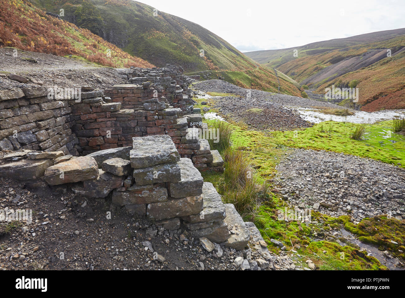 Remains of the bouse teams next to the Bunting mine, part of the once thriving lead mining industry, upper Gunnerside Ghyll Gill, Yorkshire Dales, UK Stock Photo