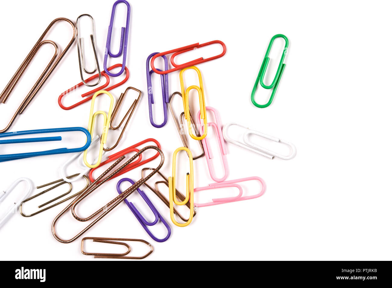 Close-up of multi-colored paper clips on a white background. Stock Photo