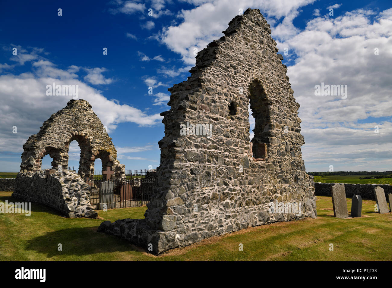 13th Century St Mary Chapel ruins of fieldstone with cemetery gravestones at Old Rattray Aberdeenshire Scotland UK Stock Photo