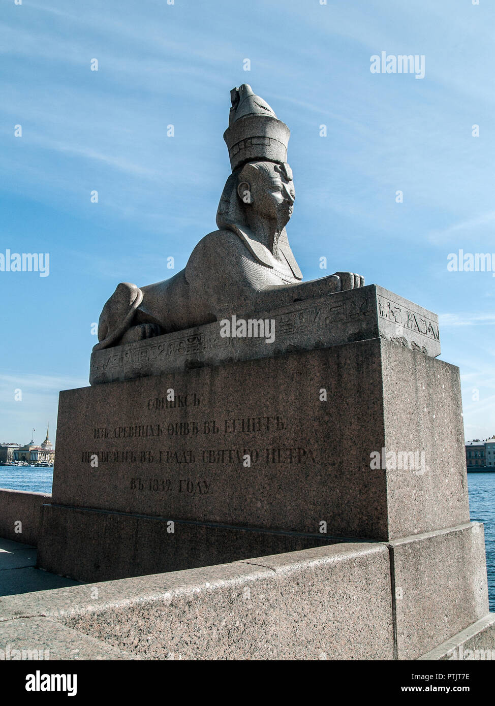 Figure of a stone sphinx from Egypt on a pedestal on the University embankment of the Neva River in the city of St. Petersburg in the summer on a sunn Stock Photo