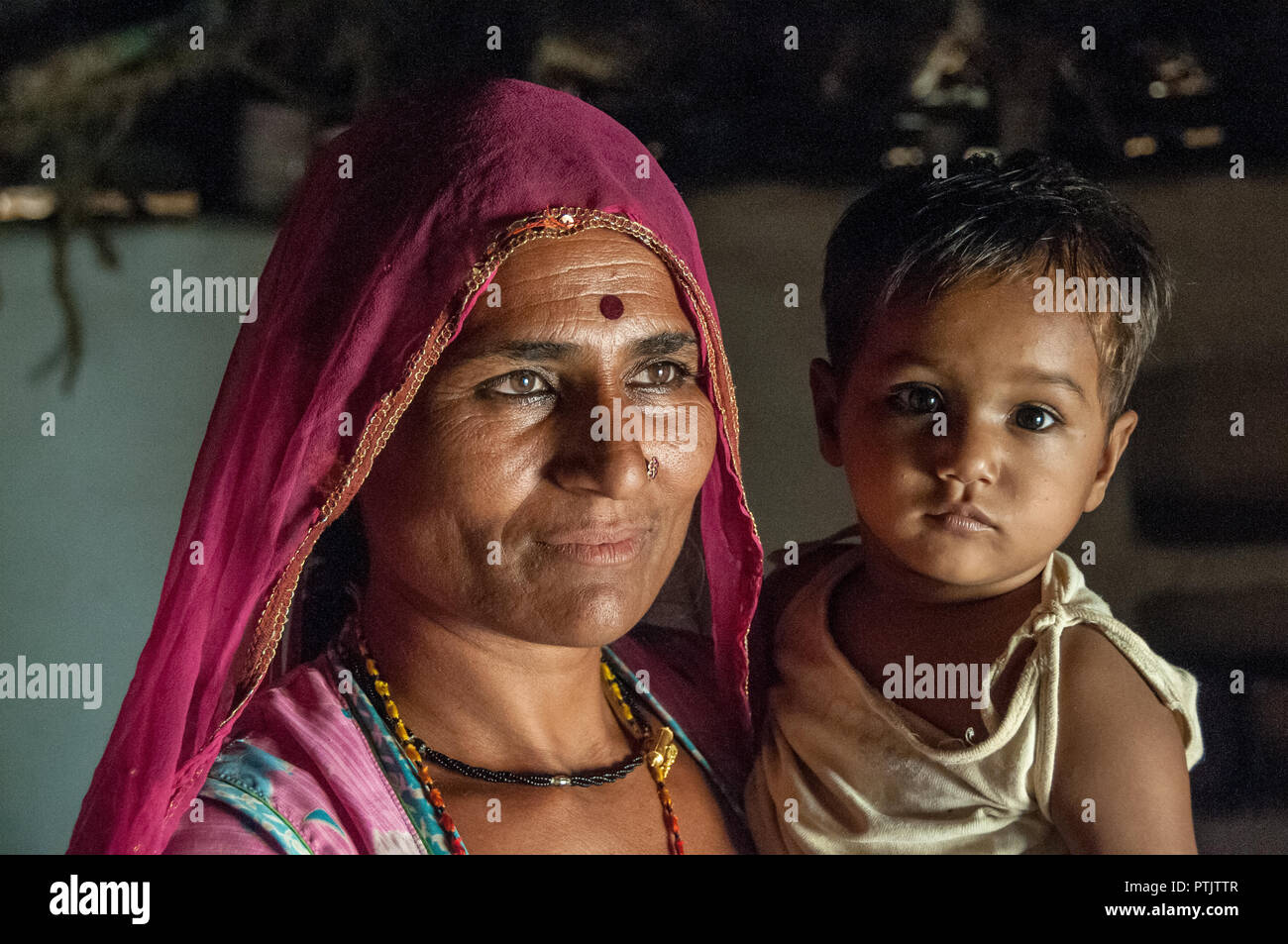 Mom and son in a village of western Rajasthan Stock Photo