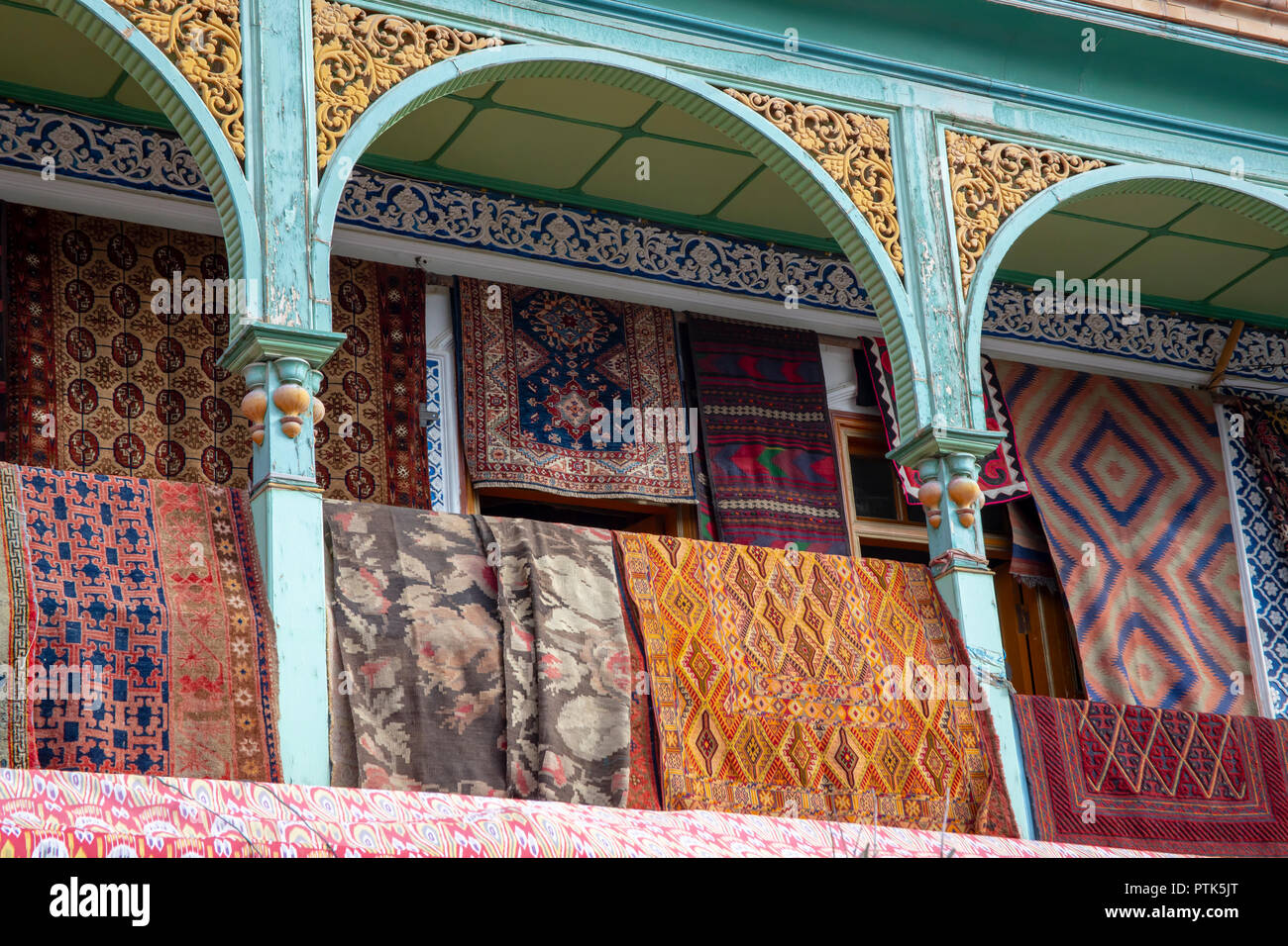 Display of carpets on display in shop of Old City Kashgar, or Kashi, Xinjiang, China. Stock Photo