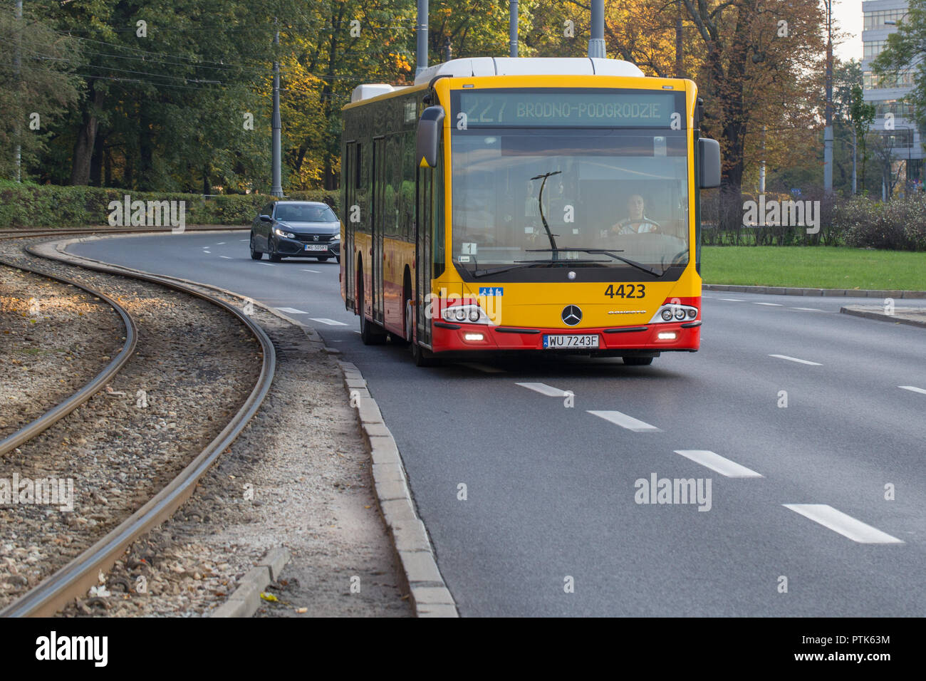 Yellow red Mercedes Benz Conecto public transport bus in Warsaw Poland  Stock Photo - Alamy
