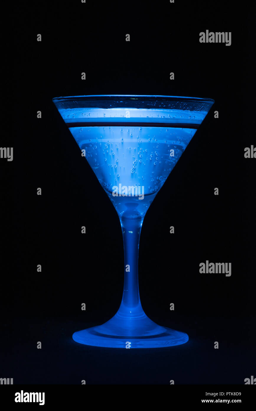 Glowing Blue Tonic Water, Quinine, As Used In Gin And Tonic Emmits Light As Visible When