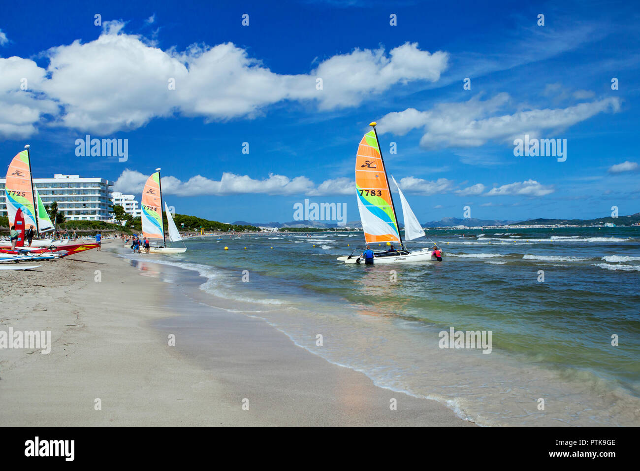 PORT D'ALCUDIA, MAJORCA, SPAIN - September 30th, 2018: People enjoy water sports on Playa de Muro beach Stock Photo