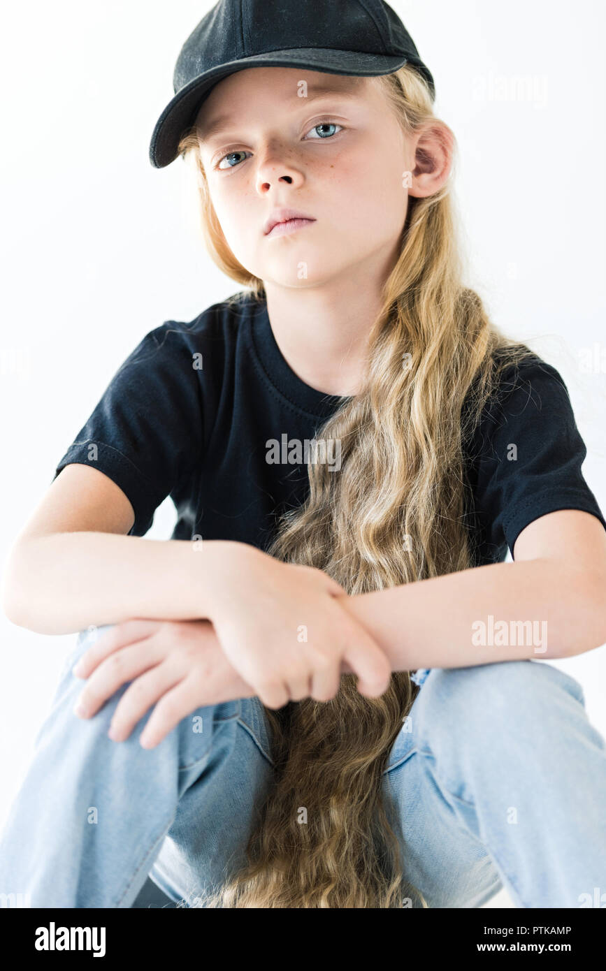 Portrait Of Beautiful Child With Long Curly Hair Wearing Black Cap