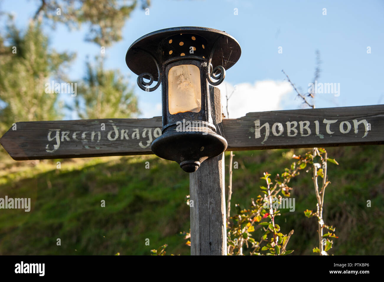 Matamata, New Zealand: Hobbiton movie set created to film Lord of the Rings and The Hobbit. Signpost and lantern marks a route. Stock Photo