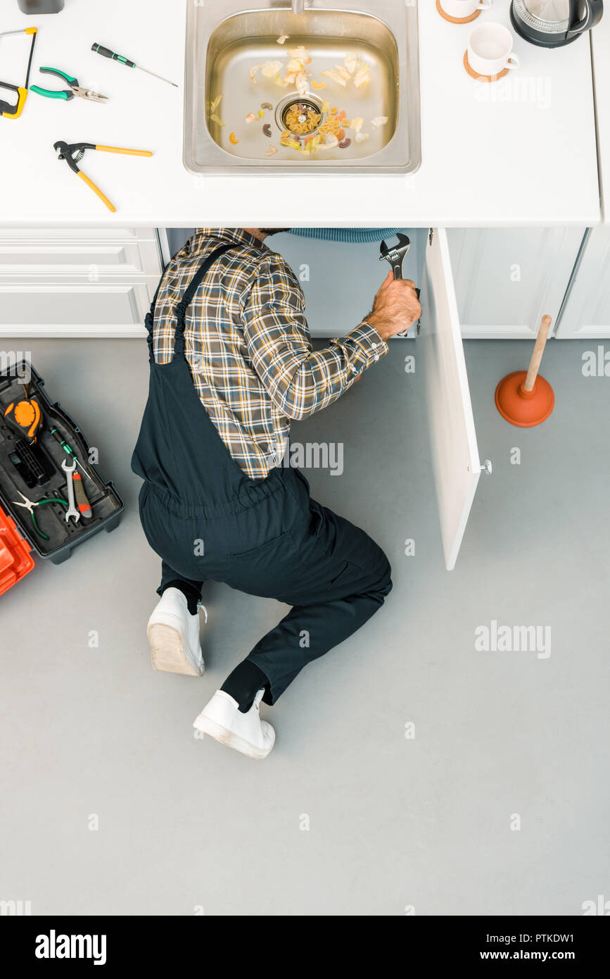 Overflowing Kitchen Sink, Clogged Drain. Hand Holding Plunger. Stock Photo  - Image of homemaker, home: 208234932