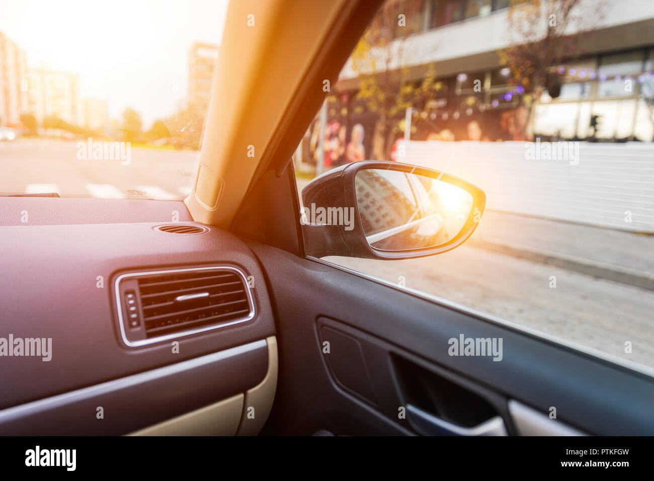 Shoot in sideview mirror of car. View from a side mirror of a car