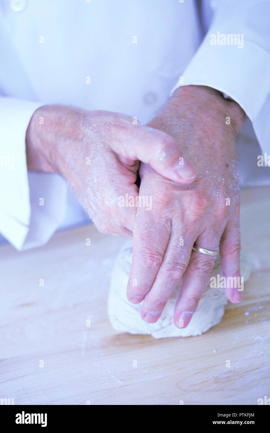 Repetitive motion hand injury to a bakery chef, USA Stock Photo