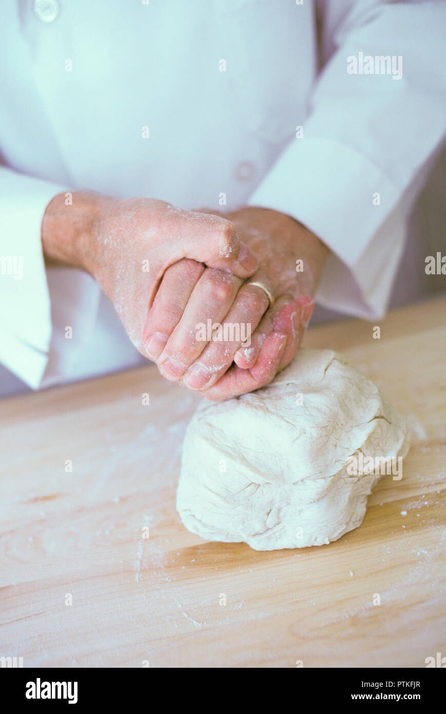 Repetitive motion hand injury to a bakery chef, USA Stock Photo