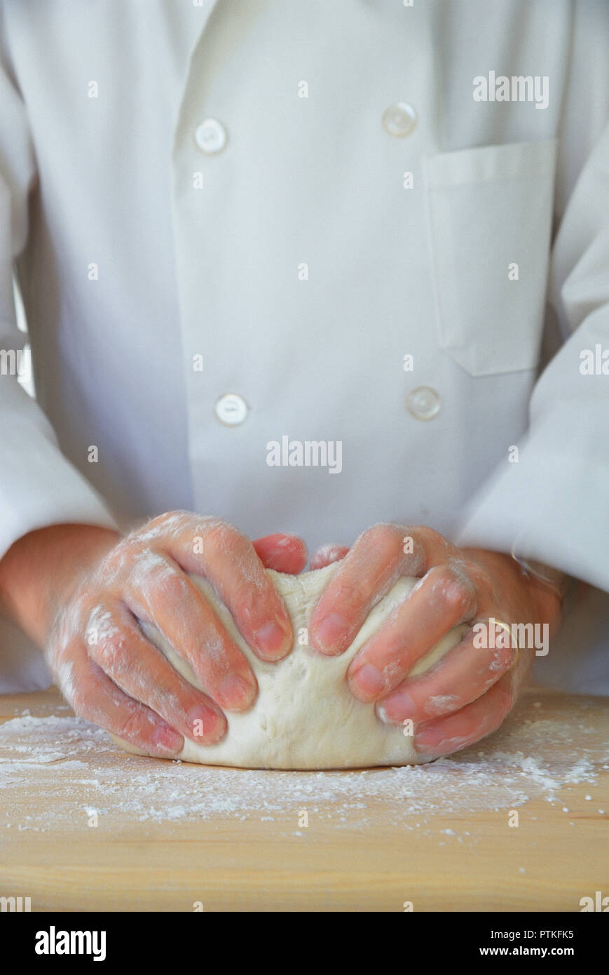 Pastry Chef Kneading dough, USA Stock Photo