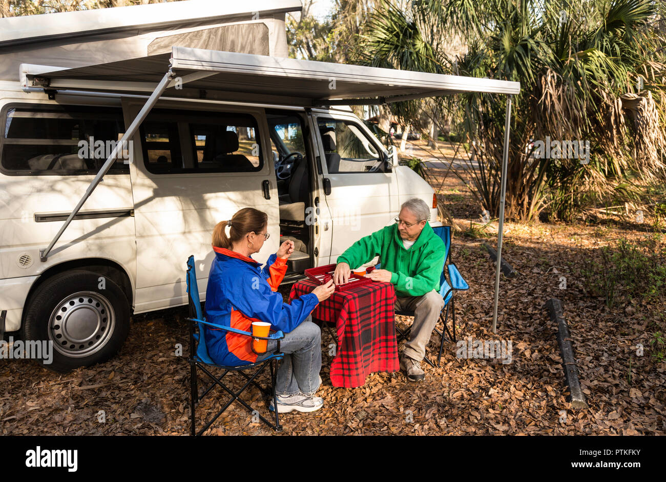 Mature Couple Enjoying RV Campground, FL USA Stock Photo