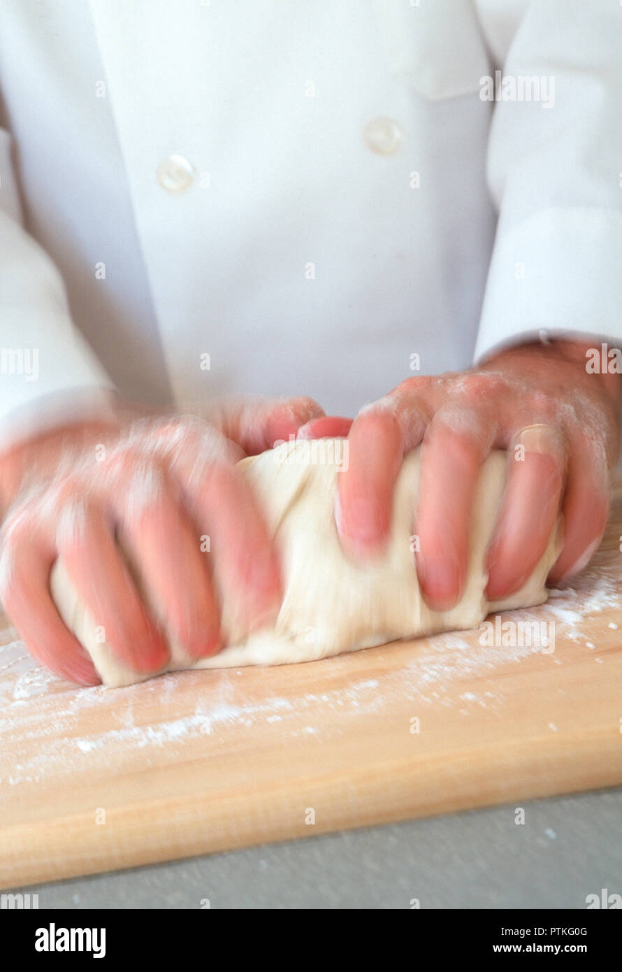 Pastry Chef Kneading Dough, USA Stock Photo
